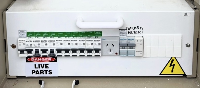 Close-up of a home switchboard with clearly labelled circuit breakers and safety switches — the kind of panel we inspect during a free safety inspection